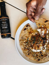 Tomasa Charred Habanero & Garlic Hot sauce drizzled over Ricotta and Peaches Flatbread
